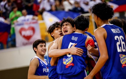 <p><strong>JUBILATION.</strong> Kieffer Alas (center) is hugged by his teammates after the Gilas Youth's 64-59 quarterfinal win over Japan in the FIBA U16 Asian Championship at Al-Rayyan Indoor Hall in Doha, Qatar on Saturday (Sept. 23, 2023). Alas had 29 points and nine rebounds as the young Filipinos qualified for the FIBA U17 World Cup in Turkey next year. <em>(Photo courtesy of FIBA)</em></p>