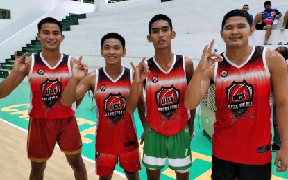 <p><strong>CHAMPION TEAM.</strong> University of Cagayan Valley players (from left) Mikee Canizares Tungcul, Troy John Narag, Andrei Coballes and Jasper Gapay pose after beating North Western University, 21-16, in the Navy division of the Reserve Officers' Training Corps Games Luzon leg men's 3x3 basketball competition at Cavite State University - Don Severino delas Alas campus gymnasium in Indang town on Saturday (Sept. 23, 2023). The host school CVSU outclassed Bicol University, 21-16, in the Army division. <em>(PNA photo by Jean Malanum)</em></p>