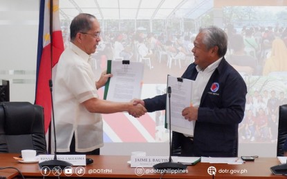 <p><strong>PARTNERS FOR GREENWAYS.</strong> Department of Labor and Employment Secretary Bienvenido Laguesma (left) and Department of Transportation Secretary Jaime Bautista shake hands following the signing of a memorandum of understanding on the EDSA Greenways project on Monday (Sept. 25, 2023). Bautista said the signing would allow for the fast-tracking of the EDSA Greenways project. <em>(Photo courtesy of DOTr)</em></p>