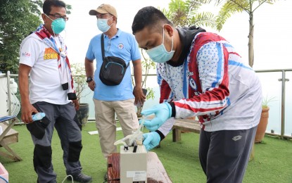 <p><strong>TESTING AIR QUALITY</strong>. The Provincial Environment and Natural Resources Office (PG-ENRO) of Batangas has been conducting air quality assessment tests in towns closest to Taal Volcano, as seen in this undated photo. The activity was initially conducted in the towns of Agoncillo, Alitagtag, Calatagan and Santa Teresita over several days. <em>(Photo courtesy of Batangas PIO)</em></p>