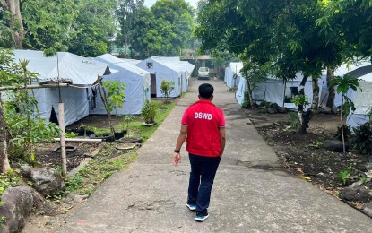 <p><strong>MONITORING EVACUEES.</strong> A Department of Social Welfare and Development-Bicol (DSWD-5) staff visits an evacuation center in this undated photo to monitor internally displaced families due to the ongoing volcanic activity of Mt. Mayon. The DSWD-5 started to distribute part of the 6,372 family food packs for the seventh wave assistance for Mayon evacuees on Tuesday (Sept. 26, 2023). <em>(Photo courtesy of DSWD-Bicol)</em></p>