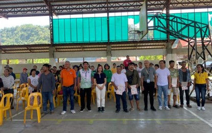 <p><strong>NEW LANDOWNERS</strong>. Beneficiaries of the DENR's Handog Titulo Program and officials of the La Union Provincial Environment and Natural Resources Office pose for a photo after the distribution of free land titles in Sudipen town, La Union province on Tuesday (Sept. 26, 2023). They were among the 361 beneficiaries of the program from January to Sept. 26 this year. <em>(Photo courtesy of PIA La Union)</em></p>