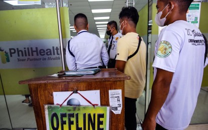 <p><strong>VULNERABLE</strong>. Services are being provided without the aid of computers at PhilHealth's Mother Ignacia Avenue branch in Quezon City in this photo taken on Sept. 26, 2023, four days after its system was attacked by the Medusa ransomware. The Philippine Computer Emergency Response Team (PH-CERT) on Tuesday (Oct. 3, 2023) warned that the cyber attackers could still exploit the data stolen from the state health insurer.<em> (PNA photo by Joan Bondoc)</em></p>
