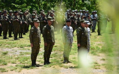 <p><strong>JOINT DRILLS.</strong> Philippine Army and Philippine Air Force troops at the opening ceremony of the five-day PA-PAF Interoperability Exercise (IOX) at the Army's 5th Infantry Division headquarters in Camp Melchor F. Dela Cruz in Gamu, Isabela on Monday (Sept. 25, 2023). Around 836 personnel from the PA and PAF are participating in the exercise.<em> (Photo courtesy of the Philippine Army)</em></p>