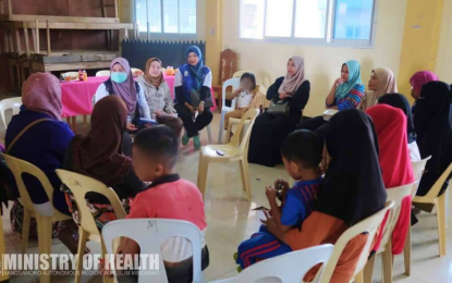 <p><strong>MEASLES OUTBREAK.</strong> Ministry of Health-Bangsamoro Autonomous Region in Muslim Mindanao (MOH-BARMM) education and promotion officer Saida Diocolano Ali (left, with face mask) meets with midwives and health frontliners on Sept. 21-23, 2023 to help contain rising cases of measles in Marawi City. Department of Health (DOH) Undersecretary Eric Tayag said Monday (March 25, 2024) that a “non-selective” immunization drive will be conducted in Mindanao following the announcement of a measles outbreak in the BARMM. <em>(Photo courtesy of MOH-BARMM)</em></p>