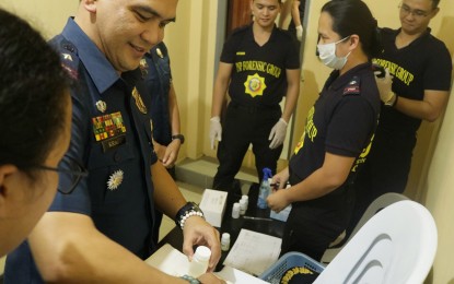 <p><strong>SURPRISE DRUG TEST.</strong> Brig. Gen. Kirby John Kraft (2nd left), director of the Police Regional Office in the Caraga Region, leads the drug testing of 47 high-ranking police officers on Tuesday evening (Sept. 26, 2023) during a regular command conference at the PRO-13 headquarters in Butuan City. Kraft warned that officers who are found positive for illegal drugs will be sanctioned. <em>(Photo courtesy of PRO-13)</em></p>