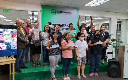 <p><strong>REFUNDS</strong>. Consumers of MORE Power receive their bill deposits in a ceremony at the utility’s corporate office in Iloilo City in July this year. The power distribution utility has refunded over PHP500,000 from June until September this year. <em>(PNA file photo by PGLena)</em></p>