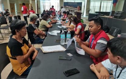 <p><strong>CASH ASSISTANCE.</strong> Micro rice retailers go through the process of validation before receiving government emergency relief aid, in this photo taken on Sept. 22, 2023. The Department of Social Welfare and Development will conduct its third payout on Friday (Sept. 29, 2023) for 405 other beneficiaries affected by the mandated rice price cap. <em>(PNA photo by Mary Judaline Flores Partlow)</em></p>