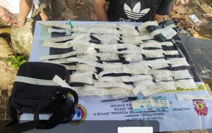 <p><strong>SEIZED.</strong> Anti-drug agents of the Estancia Municipal Police in Iloilo province lay out the seized 38 sachets of suspected shabu weighing 1.6 kg., with an estimated street value of PHP10.88 million, which were seized in Barangay Tacbuyan on Friday (Sept. 29, 2023). A male suspect who resides in Quezon City and his 22-year-old accomplice from another Estancia village were arrested. <em>(Photo courtesy of Estancia MPS)</em></p>