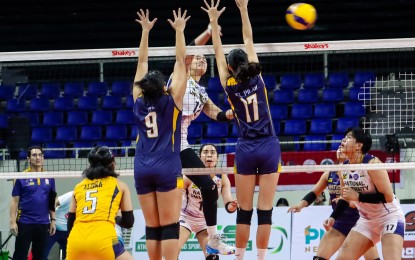 <p><strong>WINNER. </strong>Jose Rizal University's Mary May Ruiz (No. 9) and Pat del Pilar (No. 17) fail to stop National University's Alyssa Solomon during the Pool A match in the Shakey’s Super League Collegiate Pre-Season Championship Season 2 at Rizal Memorial Coliseum in Manila on Sunday (Oct. 1, 2023). The Lady Bulldogs prevailed, 25-11, 25-12, 25-11. <em>(Photo courtesy of Shakey's Super League)</em></p>