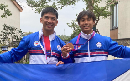 <p><strong>BRONZE FOR COO</strong>. Patrick Coo (right) and Daniel Calauag finish third and sixth in the BMX Racing of cycling in the 19th Asian Games in Hangzhou on Sunday (Oct. 1, 2023). Coo’s bronze was the seventh for Team Philippines, which also has a gold medal from Ernest John ‘EJ” Obiena in men’s pole vault. <em>(Contributed photo)</em></p>