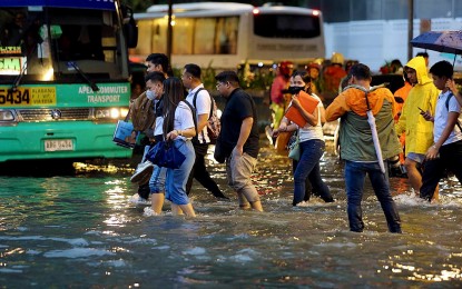 <p><strong>FLOODED.</strong> Pedestrians wade through the flooded corner of Taft and United Nations Avenues in Manila on Sept. 28, 2023. Senator Revilla Jr. on Tuesday (April 30, 2024) urged the Department of Public Works and Highways and the Metro Manila Development Authority to take proactive measures “before” the start of the rainy season to mitigate potential disaster caused by widespread flooding. <em>(PNA photo by Joan Bondoc)</em></p>