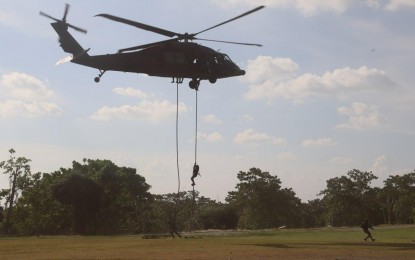 <p><strong>INTEROPERABILITY.</strong> Philippine Army troops perform fast tope insertion/extraction system capability demonstration during the closing ceremony of PA-PAF interoperability exercise (IOX) on Sept. 30, 2023. The IOX has enriched both the Army and Air Force with invaluable lessons and strong camaraderie among its troops, especially towards integrating and synchronizing operations in the military.<em> (Photo courtesy of the Philippine Army's 5th Infantry Division)</em></p>