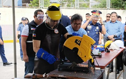 <p><strong>DEMILITARIZED.</strong> Interior and Local Government Secretary Benjamin Abalos Jr. leads the destruction of firearms seized from rebels during a ceremony in Tacloban City on Monday (Oct. 2, 2023). During the event, He reminded local government units not to abuse confidential and intelligence funds amid talks to regulate these down to the local government level. (<em>PNA photo by Sarwell Meniano)</em></p>
