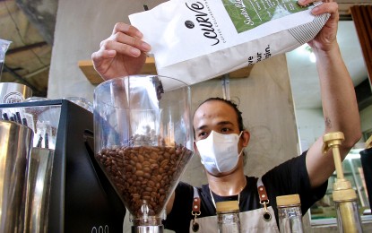 <p><strong>REVITALIZING COFFEE INDUSTRY</strong>. A coffee shop staff prepares the orders of his patrons at Brew Trip in V. Luna Street, Quezon City on Oct. 2, 2023. The Department of Agriculture said on Tuesday (March 19, 2024) that there's a need to revitalize the coffee industry, considering high domestic demand.<em> (PNA file photo by Robert Oswald P. Alfiler)</em></p>