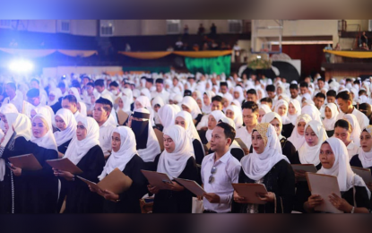 <p><strong>NEW TEACHERS.</strong> More than 900 newly hired teachers and non-teaching personnel take their oath during a ceremonial program at the Cotabato State University gymnasium in Cotabato City on Tuesday (Oct. 3, 2023). The teachers will be deployed to Sulu and Lanao del Sur school divisions starting this month. <em>(Photo courtesy of MBHTE-BARMM)</em></p>