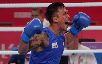 <p><strong>PARIS OLYMPIC-BOUND</strong>. Eumir Marcial celebrates after knocking out Ahmad Ghousoon of Syria in the second round to advance in the gold medal round of the men’s 80kg class of the 19th Asian Games boxing competition in Hangzhou, China on Wednesday (Oct. 4, 2023). Marcial also earned an outright berth in the 2024 Paris Olympics. <em>(PSC-POC Media Group photo)</em></p>