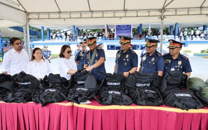 <p><strong>NEW ASSETS.</strong> PNP chief Gen. Benjamin Acorda Jr. (center) leads the blessing of PHP1.48 billion worth of new assets in Camp Crame, Quezon City on Monday (Oct. 2, 2023). These new assets include marked light transport vehicles, 4x4 personnel carriers, 4x2 patrol jeep single cabs, 5.56-mm basic assault rifles, 5.56-mm ball ammunition, enhanced combat helmets and enhanced combat and all-purpose vests.<em> (Photo courtesy of PNP Public Information Office)</em></p>