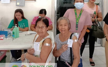 <p><strong>PROTECTED</strong>. Senior citizens from Tabaco City show their vaccination cards after receiving their flu shots in this undated photo. The Department of Health- Center for Health Development-Bicol on Thursday (Oct. 5, 2023) is urging all seniors to get vaccinated for added protection at various health centers in the region. <em>(Photo courtesy of DOH-CHD-Bicol)</em></p>