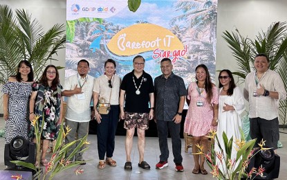 <p><strong>DIGITAL NOMADS.</strong> Department of Information and Communications Technology Secretary Ivan John Uy (center) graces Thursday (Oct. 5, 2023) the opening ceremony of the 1st Philippine Digital Nomad Summit which will run from Oct. 5 to 7 in Del Carmen, Siargao Island, Surigao del Norte. He is joined by Surigao del Norte 1st District Rep. Francisco Jose Matugas II (4th right) and Mindanao Development Authority chair Maria Belen Acosta (4th left) at the event.<em> (Photo courtesy of MinDA)</em></p>