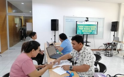 <p><strong>PAYOUT</strong>. The last batch of micro rice retailers in Negros Oriental receives on Thursday (Oct. 5, 2023) PHP 15,000 each in government cash assistance to defray losses due to the rice price cap. Despite the lifting of the mandated price ceiling on regular- and well-milled rice, these beneficiaries still qualified for the cash aid as they were profiled during the coverage period of EO 39 last month. <em>(PNA photo courtesy of DTI-Negros Oriental)</em></p>