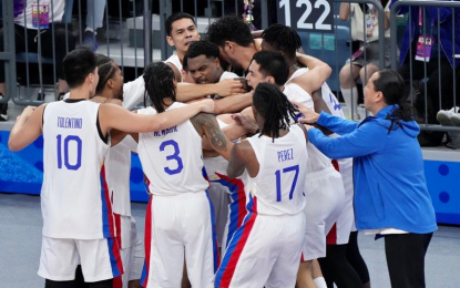 <p><strong>BROWNLEE MAGIC.</strong> Gilas Pilipinas celebrate after stunning host China, 77-76, to advance in the gold medal match of the men’s basketball in the 19th Asian Games in Hangzhou, Zhejiang, China on Wednesday night (Oct. 4, 2023). Justin Brownlee scored 17 of his 33 points, including a three-pointer in the final 23 seconds, in the fourth quarter to help the Philippines return to the finals since its silver finish in the 1990 edition.<em> (PSC-POC Media Group photo)</em></p>