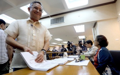 <p><strong>VOTE-BUYING COMPLAINTS</strong>. Commission on Elections (Comelec) Deputy Executive for Operations Rafael Olaño files disqualification petitions against five candidates for the Barangay and Sangguniang Kabataan Elections (BSKE), allegedly involved in vote buying, at the commission’s main office in Intramuros, Manila on Friday (Oct. 6, 2023). Olaño said the Committee on Kontra Bigay is expecting to receive more vote-buying complaints as the campaign period nears. <em>(PNA photo by Yancy Lim)</em></p>