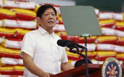 <p>AID DISTRIBUTION. <span class="s1">President Ferdinand R. Marcos Jr. on Friday (Oct. 6, 2023) leads the distribution of rice to Pantawid Pamilyang Pilipino Program (4Ps) beneficiaries at the Capiz Gymnasium in Roxas City, Capiz. In his speech, Marcos said the government would also provide assistance to small rice farmers. <em>(PNA photo by Alfred Frias)</em></span></p>