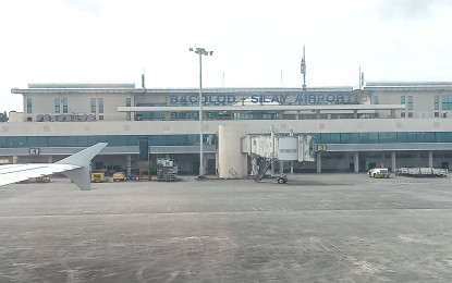 <p>The runway and terminal building of Bacolod-Silay Airport in Negros Occidental.  <em> (PNA Bacolod file photo)</em></p>