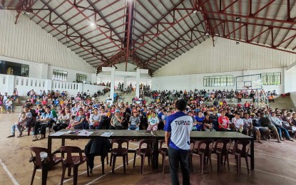 <p><strong>ORIENTATION</strong>. Ramezes Torres, a senior labor and employment official, tells disadvantaged workers from Pola, Oriental Mindoro on Wednesday (Oct. 11, 2023) what to expect from their 10-day job under the government's Tulong Panghanapbuhay sa Ating Disadvantaged/Displaced Workers (TUPAD) program. Some 2,637 workers from this municipality will be taking part in the program beginning Oct. 12, 2023.<em> (Photo courtesy of Rhyme Torres)</em></p>
