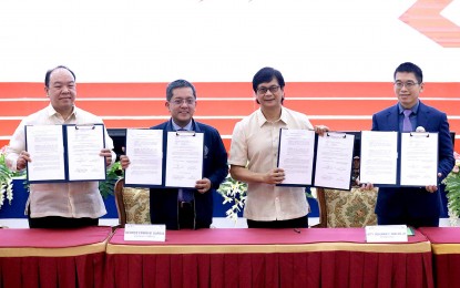 <p><strong>CRACKDOWN VS. VOTE-BUYING.</strong> The Commission on Elections (Comelec) signs a memorandum of agreement (MOA) with the Department of the Interior and Local Government against vote-buying in the forthcoming village polls Wednesday (Oct. 11, 2023). The MOA also serves as a reminder to local government units to refrain from supporting illegal campaign activities of BSK bets. <em>(PNA Photo by Robert Alfiler)</em></p>