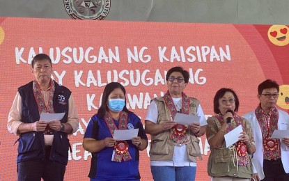 <p><strong>MENTAL HEALTH PROGRAM.</strong> DOH Undersecretary Dr. Maria Rosario Singh-Vergeire (center) leads local officials during the launching of "Biyaheng Kalusugan: Mental Health Caravan" at Sorsogon State University in Sorsogon City on Wednesday (Oct. 11, 2023). The agency is stepping up its mental health programs by establishing centers and giving free medicines for this priority area of health.<em> (PNA photo by Connie Calipay)</em></p>