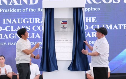 <p><strong>POULTRY FARM.</strong> President Ferdinand Marcos Jr. (left) and San Miguel Corporation president and chief executive officer Ramon Ang unveil the landmark of the World-Class Controlled-Climate Magnolia Poultry Farm on Thursday (Oct. 12, 2023) at Hagonoy, Davao del Sur. A project of San Miguel Foods Inc. (SMFI), the mega farm anticipates the production of 80 million birds or about 200 million kilos in live weight per farm to be harvested annually. <em>(PNA photo by Robinson Niñal Jr.)</em></p>
