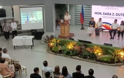 <p><strong>LITERACY FOR SECURED NATION</strong>. Vice President and Education Secretary Sara Z. Duterte (standing behind rostrum) speaks before over 500 public education leaders in the Philippines during the National Literacy Conference hosted by the Department of Education-Central Visayas at the Ecotech Center in Cebu City on Thursday (Oct. 12, 2023). Duterte underscored the role of educational literacy for country whose people contribute for peace, development, and prosperity.<em> (PNA photo by John Rey Saavedra)</em></p>