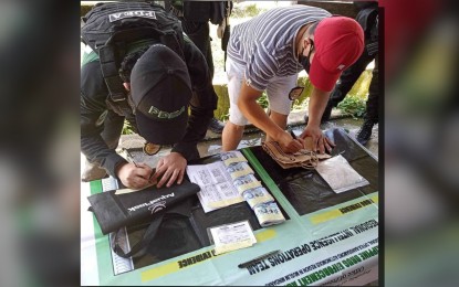 <p><strong>SEIZED DRUGS.</strong> Anti-narcotics agents account for the shabu seized from a 16-year-old boy during a drug buy-bust on Wednesday (Oct 11, 2023) in Barangay Ungap, Sultan Kudarat, Maguindanao del Norte. A total of PHP3.4 million worth of shabu was seized from the boy who was turned over to the social welfare office in Sultan Kudarat. <em>(Photo courtesy of PDEA-BARMM)</em></p>