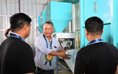<p><strong>POST-HARVEST FACILITY</strong>. Philippine Center for Postharvest Development and Mechanization (PHilMech) Director III Joel V. Dator (center) shows the post-harvest facility which was turned over to the local government of Baliuag, Bulacan on Wednesday (Oct. 11, 2023). PHilMech has partnered with local government units in Central Luzon for the establishment of rice processing facilities under the Rice Competitiveness Enhancement Fund (RCEF) mechanization program.<em> (Photo courtesy of PHilMech)</em></p>