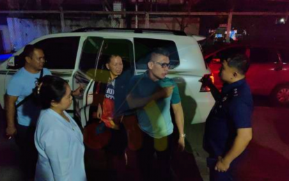 <p><strong>ARRESTED.</strong> Mayor Solayman Sandigan (in black jacket, center) of Datu Salibo town in Maguindanao del Sur province arrives at the CIDG office in Cotabato City after his arrest in his hometown on Wednesday night (Oct. 11, 2023). Sandigan was linked to the murder of Datu Salibo town councilor Demsom Silongan on April 17, 2023. <em>(Photo courtesy of Ferdinand Cabrera of Kutangbato News)</em></p>