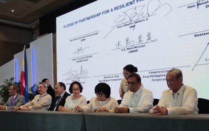 <p><strong>CONFAB HOST.</strong> Representatives of the national government, private sector and development organizations on Friday (Oct. 13, 2023) sign a pledge of partnership for a resilient Philippines and Asia Pacific Region during the launch of 2024 Asia-Pacific Ministerial Conference on Disaster Risk Reduction in Pasay City. The representatives pledged to support the successful delivery of the conference, ensuring its success impacts the present and future generations.<em> (PNA photo by Ma. Teresa P. Montemayor)</em></p>