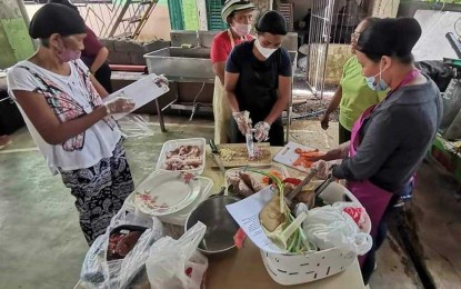 <p><strong>PREVENTION.</strong> Members of the Rural Improvement Club in Tobias Fornier, Antique, on Sept. 8, 2023 undergo training on meat processing in anticipation of the high demand for Noche Buena products. Antique Provincial Veterinarian III Dr. Paul Songcayawon, in an interview on Friday (Oct. 13) said pork-based products from areas affected by the African swine fever are not allowed to enter the province.  (<em>Photo courtesy of Antique ProVet</em>)</p>