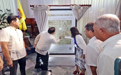 <p><strong>MURILLO VELARDE MAP.</strong> Gov. Gwendolyn Garcia and Mel Velasco look at the Murillo Velarde Map of 1734 gifted to the Province of Cebu on the occasion of the governor's birthday on Thursday (Oct. 13, 2023). The map is considered the "mother of all Philippine maps" and was used to assert the country's claim over some territories in the West Philippine Sea. <em>(Photo courtesy of the Cebu Capitol PIO)</em></p>