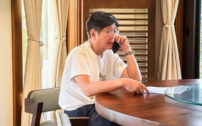 <p><strong>WORDS OF COMFORT AND ASSURANCE.</strong> President Ferdinand R. Marcos Jr. speaks with the sister of Loreta Villarin Alacre, the third Filipino killed in Israel, in a phone call on Sunday (Oct. 15, 2023) to extend his condolences and assure the bereaved family that the government will provide all necessary support. Marcos said the government is now focusing on how to repatriate Alacre’s remains. <em>(Photo courtesy of PCO)</em></p>