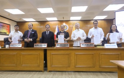 <p><span data-preserver-spaces="true"><strong>PARTNERSHIP.</strong> Commission on Elections officials, led by Chair George Erwin Garcia, and Upholding Life and Nature (ULAN) executive director Ronaldo Gutierrez (3rd and 6th from left) show the memorandum of agreement for various collaborations signed at the poll body’s head office in Intramuros, Manila on Tuesday (Oct. 17, 2023). Comelec and ULAN will hold voter education initiatives, election day surveys and monitor emergency accessible polling places related to the Oct. 30 Barangay and Sangguniang Kabataan Elections. <em>(PNA photo by Yancy Lim)</em></span></p>
<p> </p>