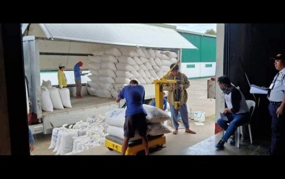 <p><strong>PALAY PROCUREMENT.</strong> Farmers in Zambales province sell their palay harvest to the National Food Authority (NFA) in this undated photo. With the imposition of new and higher buying prices, farmers have vowed to support the NFA's palay procurement program. <em>(Photo courtesy of NFA-Zambales)</em></p>