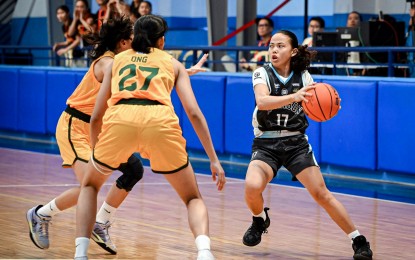<p><strong>DOMINANCE.</strong> Adamson University's Kim Limbago (No. 17) tries to escape two defenders from Far Eastern University during the University Athletic Association of the Philippines (UAAP) Season 86 women's basketball at the Adamson University gym on Oct. 18, 2023. Adamson dominated FEU, 71-50, to nail a second win in six games. <em>(UAAP photo)</em></p>