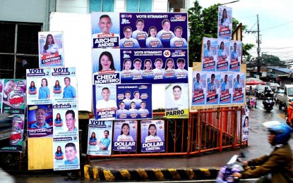 <p><strong>AND THE GAME BEGINS</strong>. Campaign posters of candidates for the Barangay and Sangguniang Kabataan Elections (BSKE) mushroom at the corner of Farmers and Angel Santos Streets in Barangay Tumana, Marikina City on Thursday (Oct. 19, 2023), the first day of the campaign period. The Commission on Elections reminded BSKE candidates to place their posters only at designated common poster areas.<em> (PNA photos by Ben Briones)</em></p>