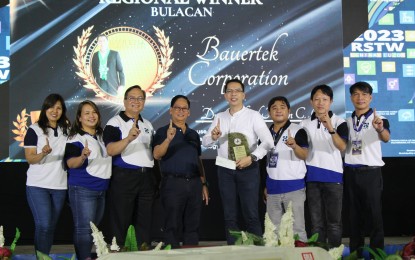 <p><strong>REGIONAL WINNER</strong>. Bauertek Corporation, a manufacturer of food supplements with a facility in Guiguinto, Bulacan, was hailed as the regional winner of the Best SETUP Adoptor Award. The firm's general manager Richard Nixon Gomez (fifth from left) holds the award given by the Department of Science and Technology led by regional director Julius Caesar Sicat (third from left) during the Regional Science and Technology Week celebration in Botolan, Zambales on Thursday (Oct. 19, 2023)<em> (Photo courtesy of DOST Region 3)</em></p>