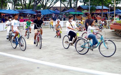 <p><strong>OUTDOOR FUN.</strong> Kids enjoy a bike ride inside the Magsaysay Park in Davao City on Aug. 16, 2023. The park, where bicycles can be rented at PHP60 per hour, is open from noon until midnight. <em>(PNA photo by Robinson Niñal Jr.)</em></p>