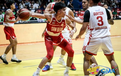 <p><strong>MY BALL.</strong> San Beda University's Jomel Puno takes on Emilio Aguinaldo College defenders during the National Collegiate Athletic Association Season 99 men's basketball at Filoil EcoOil Centre in San Juan City on Sunday (Oct. 22, 2023). The Red Lions won, 86-72, to take solo second place at the end of the first round of eliminations. <em>(NCAA photo)</em></p>