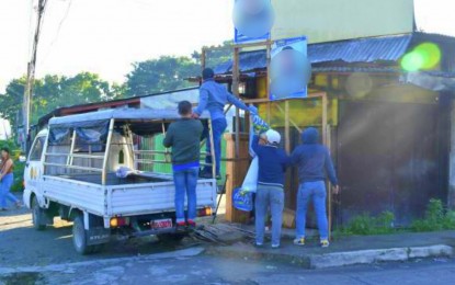 <p><strong>ILLEGAL POSTERS.</strong> Comelec personnel and its deputies remove some 700 oversized campaign materials of candidates in the Barangay and SK Elections in Koronadal City on Monday (Oct. 23, 2023). The City Comelec office has vowed to remove all posters displayed outside common poster areas in compliance with election laws. <em>(Photo courtesy of Comelec-Koronadal)</em></p>
