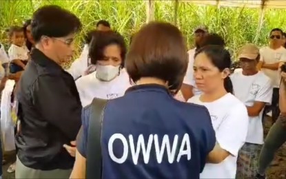 <p><strong>CONDOLENCES.</strong> Overseas Workers Welfare Administration Administrator Arnell Ignacio (left) condoles with the siblings of Negrense caregiver Loreta Villarin Alacre, who was killed in the Hamas attacks in Israel, during his visit to their family residence in Cadiz City, Negros Occidental Monday afternoon (Oct. 23, 2023). Ignacio was joined by OWWA-Western Visayas OIC Regional Director Rizza Joy Moldez, who led the agency personnel in assisting the Alacre family in the preparations for the wake of Loreta. <em>(Screenshot from OWWA Facebook video)</em></p>